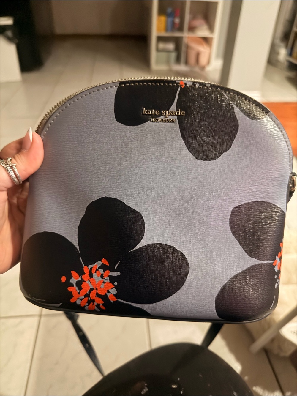 kate spade lavender floral cross body with black and orange accents